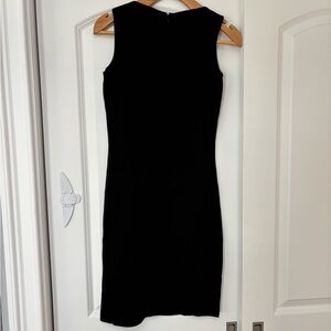 Brand new St. John Classic Black Mini Dress size 2 
Will ship asap 4 new years
